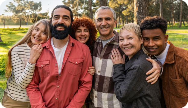 A group of 6 people hugging and posing for a photo
